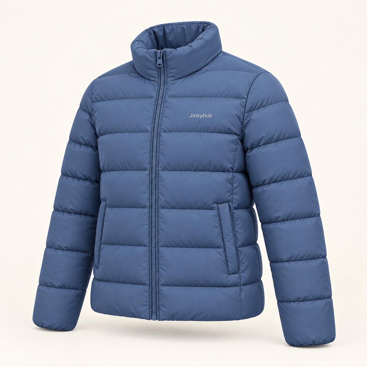 Jinxyhub Summit Quilted Puffer Jacket in slate blue, three-quarter view showing stand collar, quilted panels and side pocket.